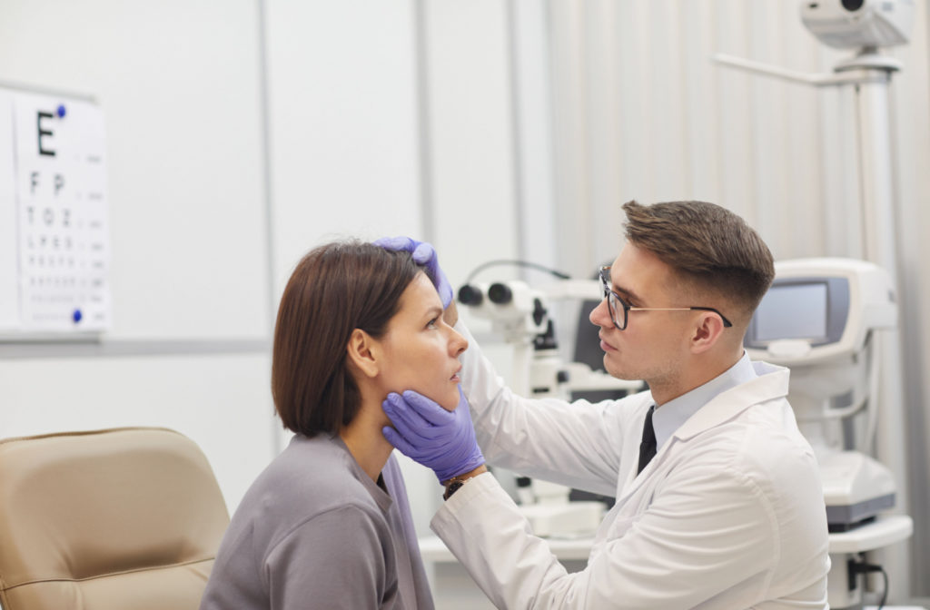 doctor looking at ladies eye for Treatment Options for Pink Eye Black